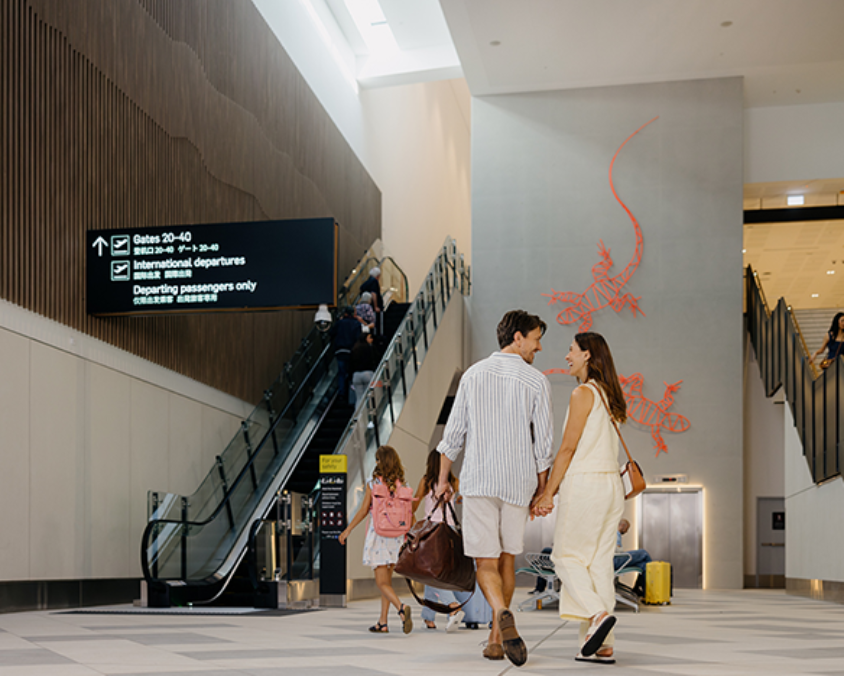 Couple walking through airport